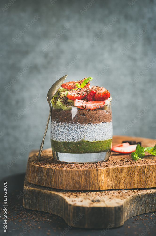Healthy detox breakfast concept. Matcha, almond milk, cocoa chia seed pudding with fresh fruit, berr