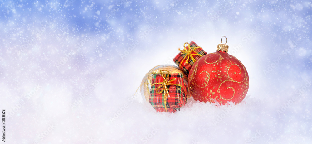 Winter background with christmas ball and gift box