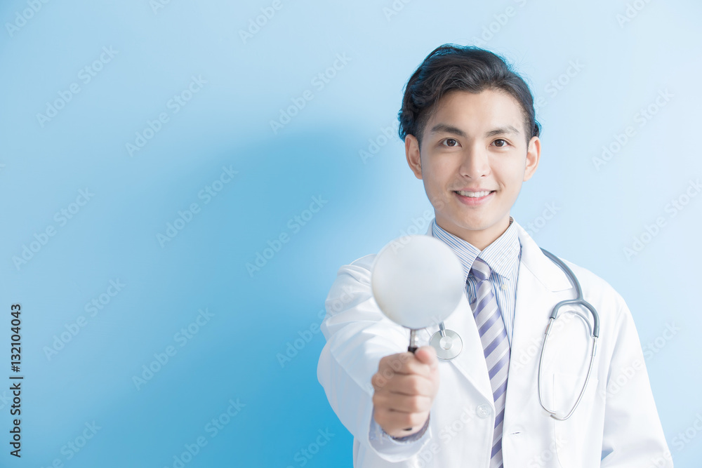 male doctor take magnifier