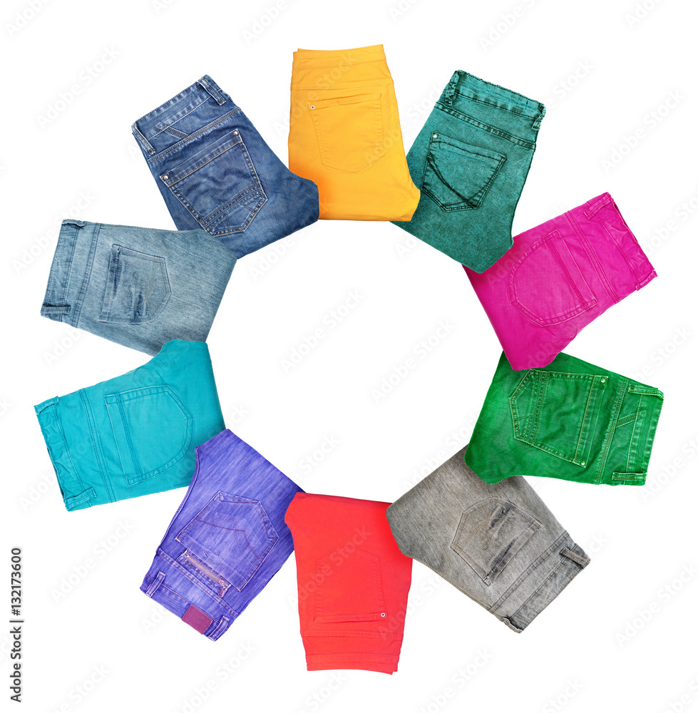 Collection of folded multicolored jeans isolated on white