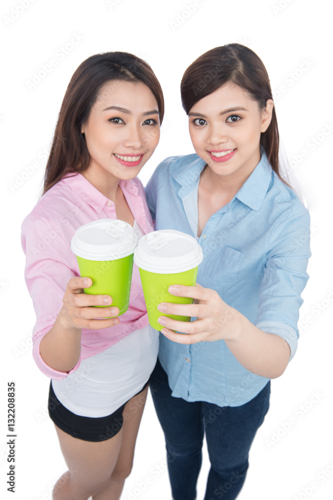 Two charming woman friends enjoying coffee
