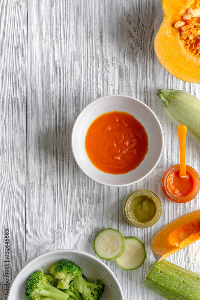 baby vegetable puree on wooden background top view