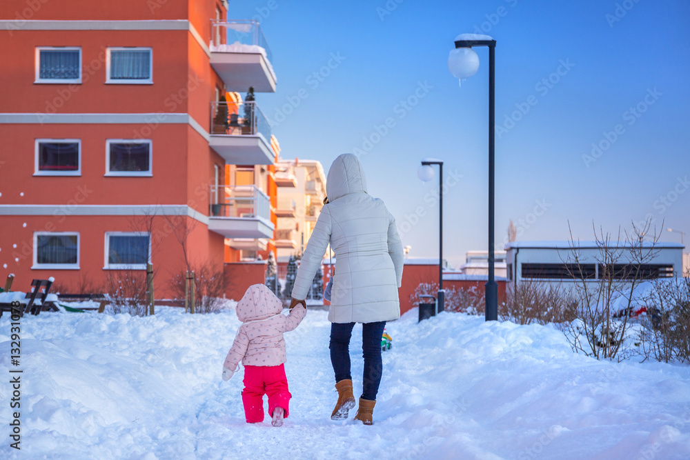 Mother and daughter on winter walk