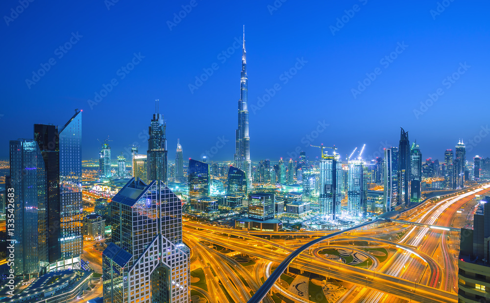 DUBAI ,UNITED ARAB EMIRATES-MARCH 5, 2016: Dubai skyline at sunset with beautiful city center lights