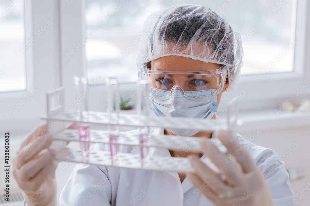 Scientist holding laboratory test tube