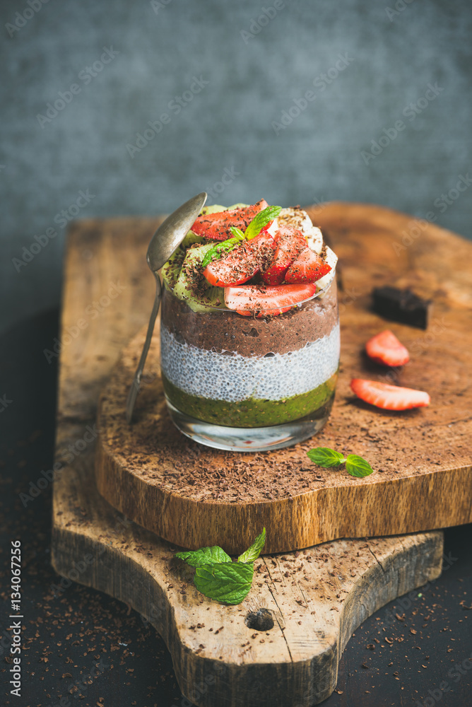 Healthy breakfast. Matcha, almond milk, cocoa chia seed pudding with fresh fruit, berries, mint and 