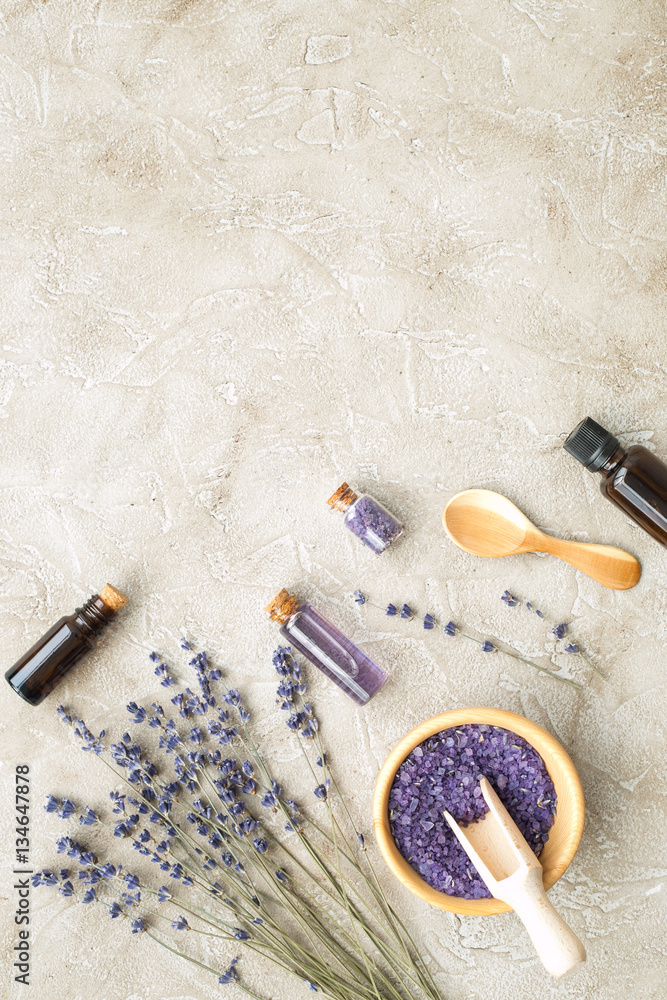 Essential oil and lavender salt with flowers top view