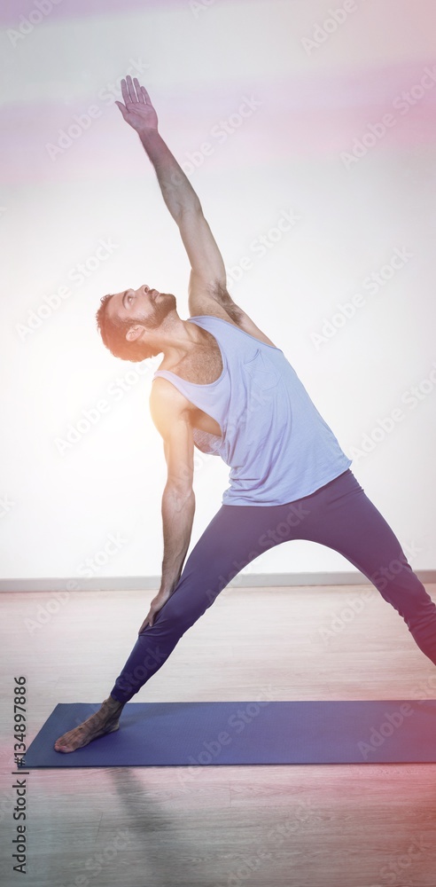 Man doing extended triangle pose