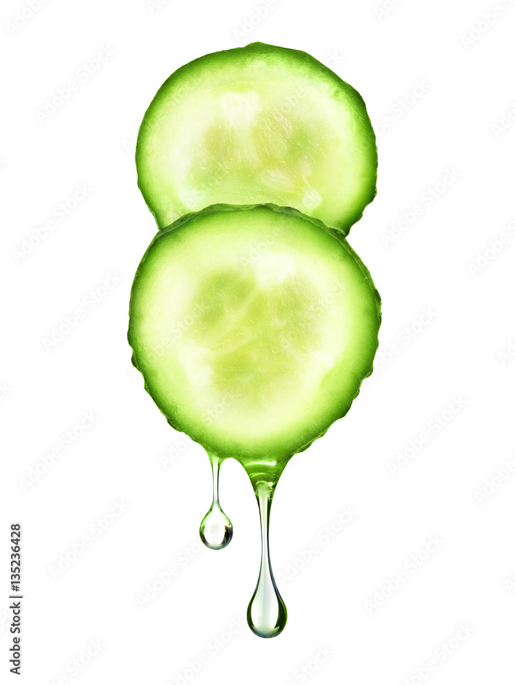 drop flowing from two fresh slices of cucumber on white backgrou