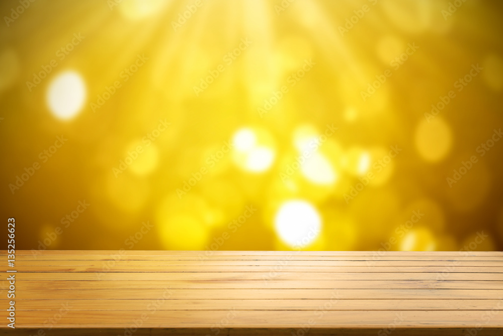 Wood shelf table on gold light bokeh background.