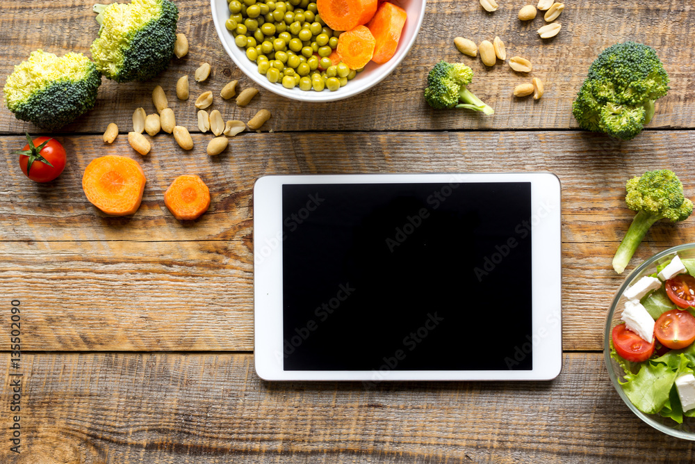 concept diet and tablet with vegetables mock up