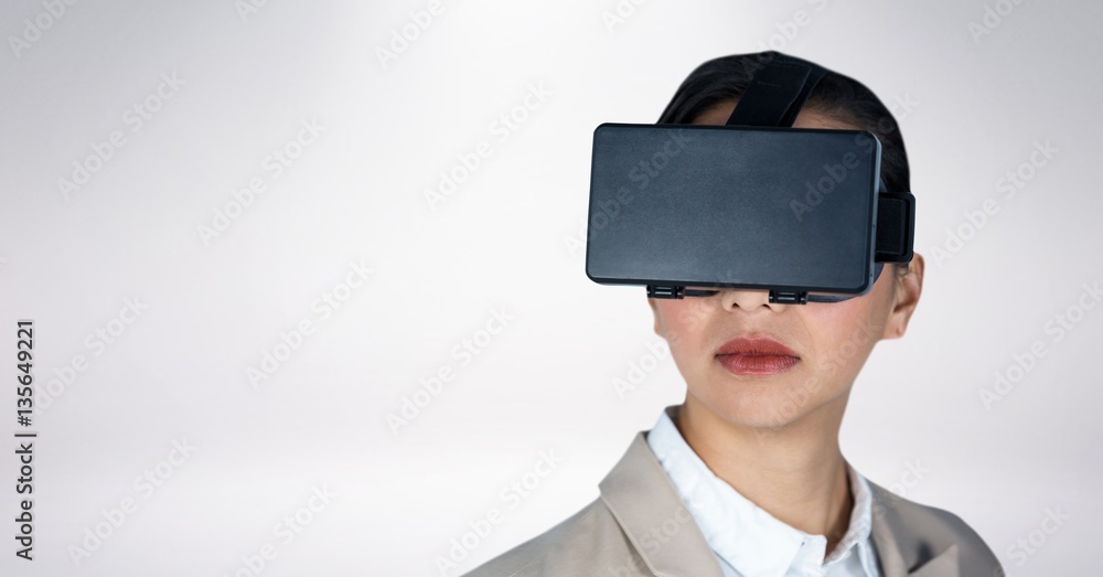 Business woman wearing vr headset against white background