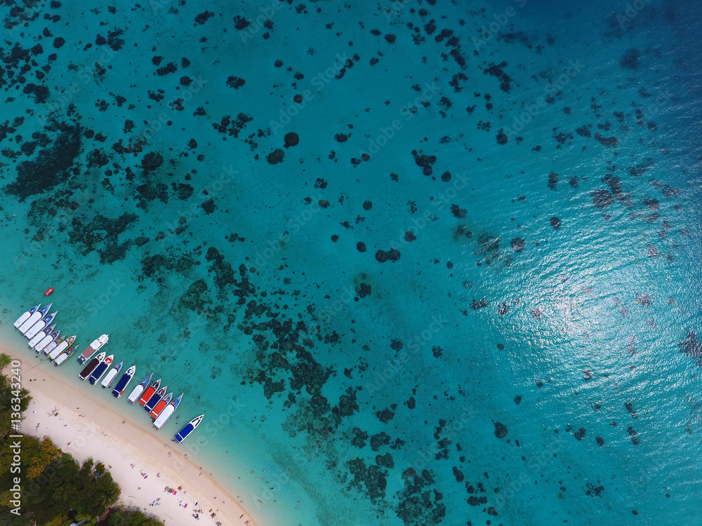 Aerial view on tropical beach with boats