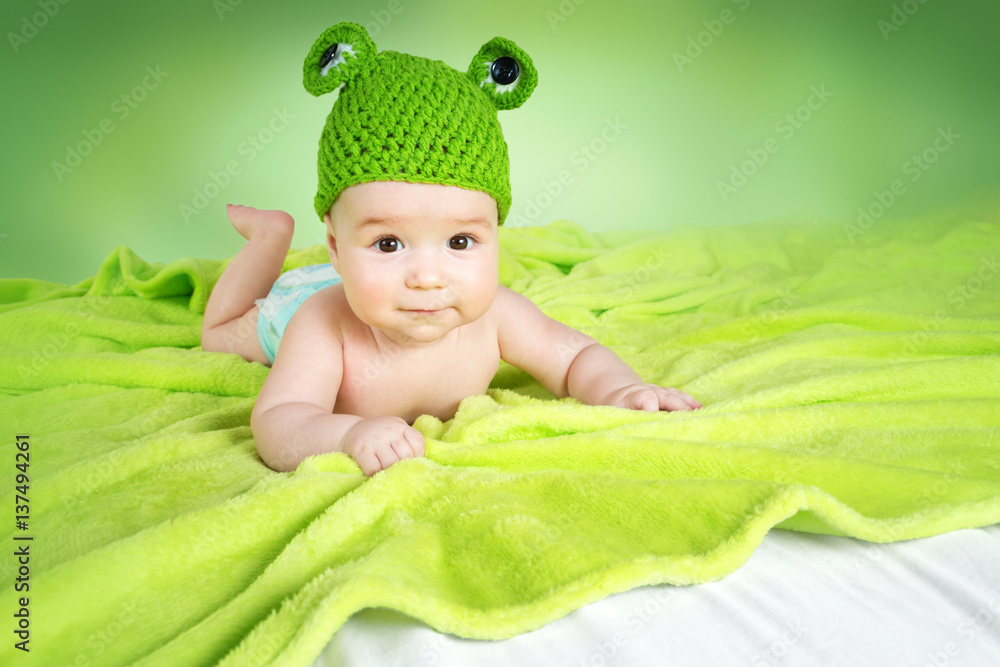 Baby in frog hat