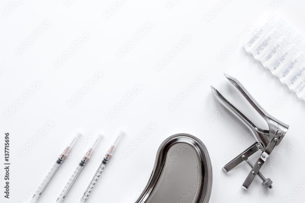 instruments of gynecologist on white background top view mock up