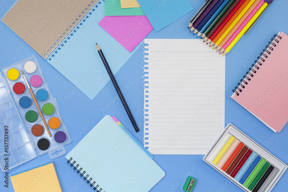 School supplies on blue background,back to school concept.