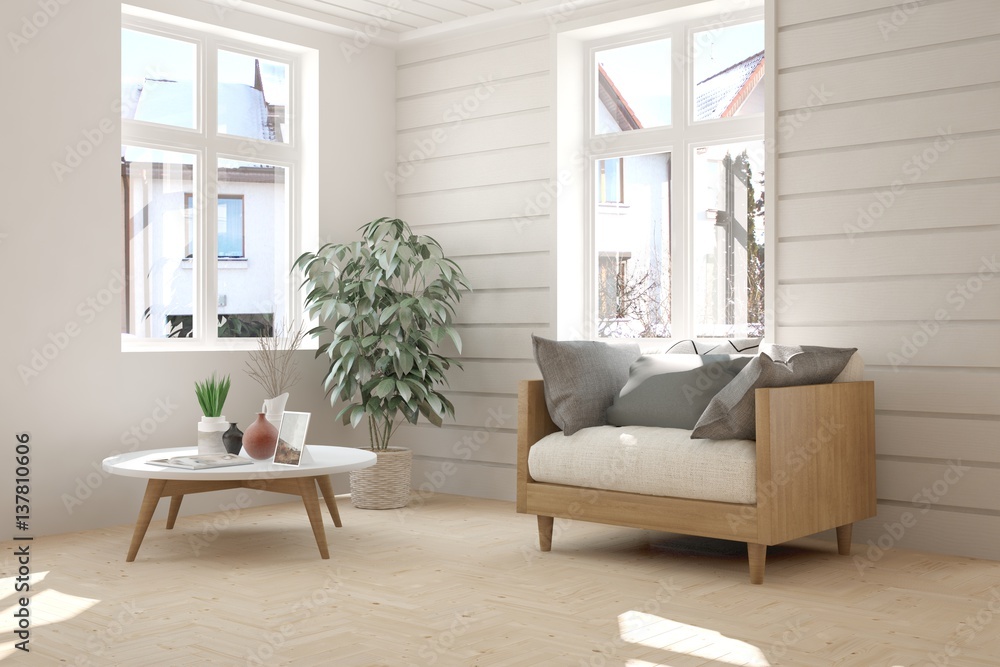 白色房间，配有扶手椅和窗户的冬季景观。斯堪的纳维亚室内设计