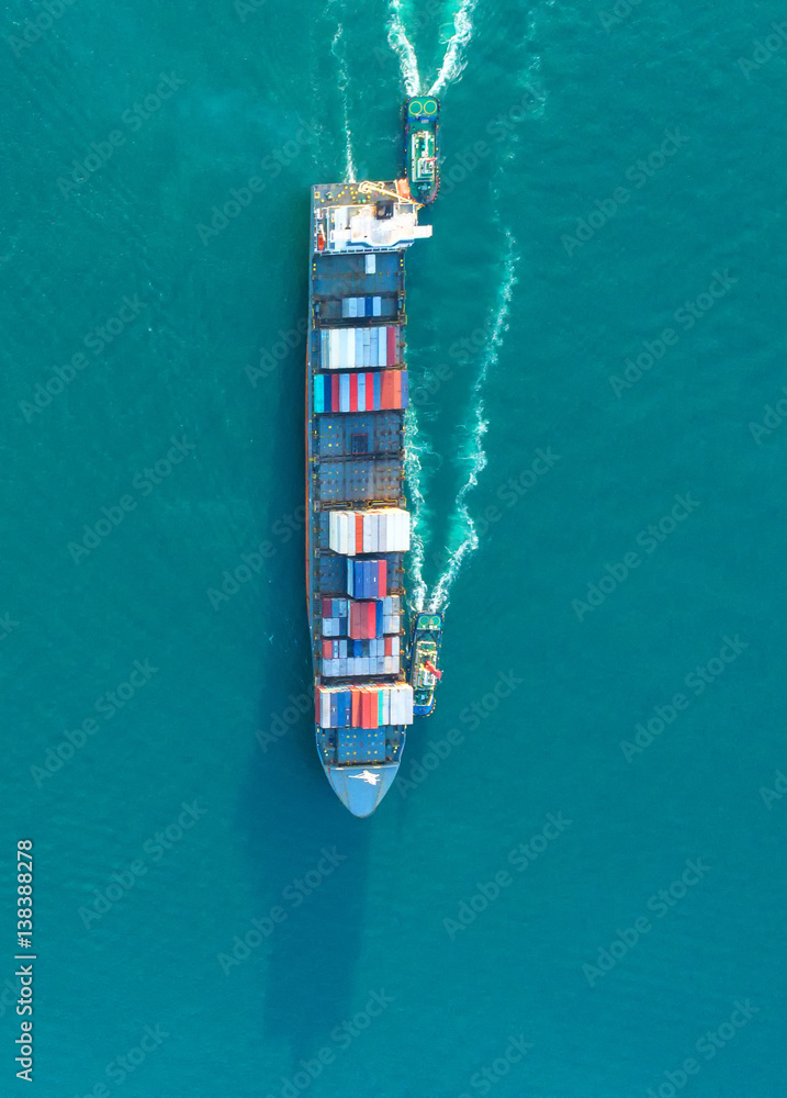 container ship in import export and business logistic.By crane ,Trade Port , Shipping.cargo to harbo