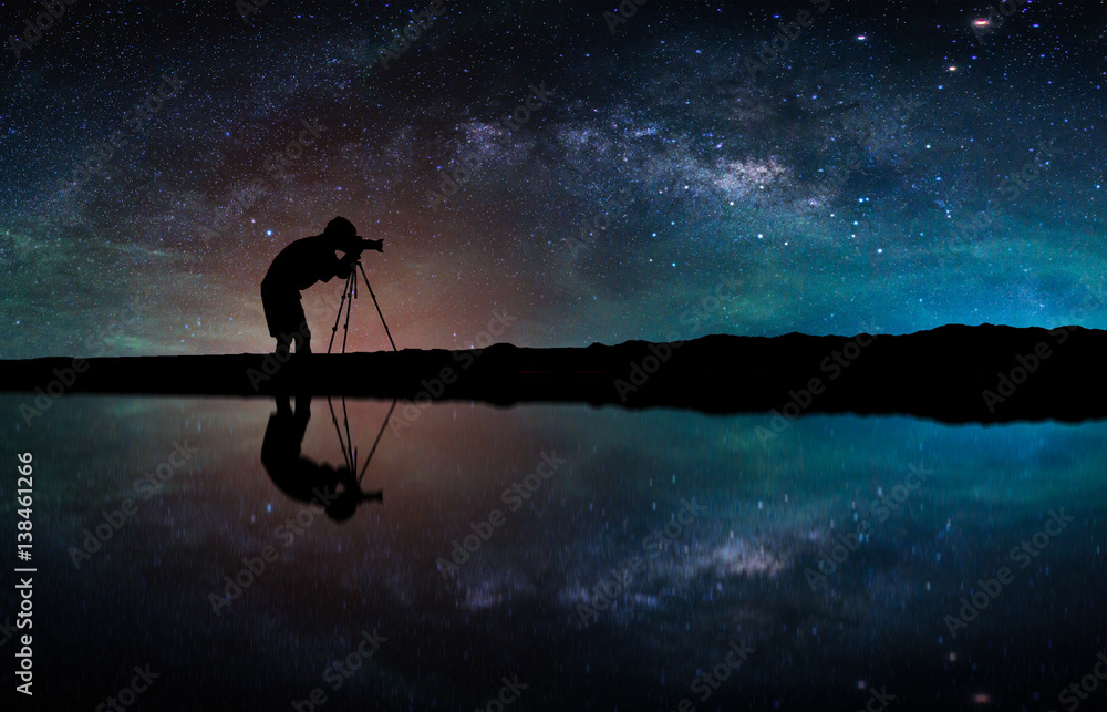 Landscape with Milky way galaxy. Night sky with stars and silhouette Photographer take photo on the 