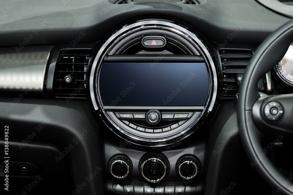 Interior view of car. Modern technology car dashboard, radio and aircondition control button.