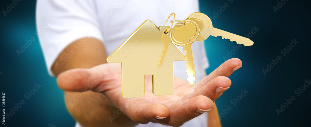 Businessman holding key with house keyring in his hand 3D rendering