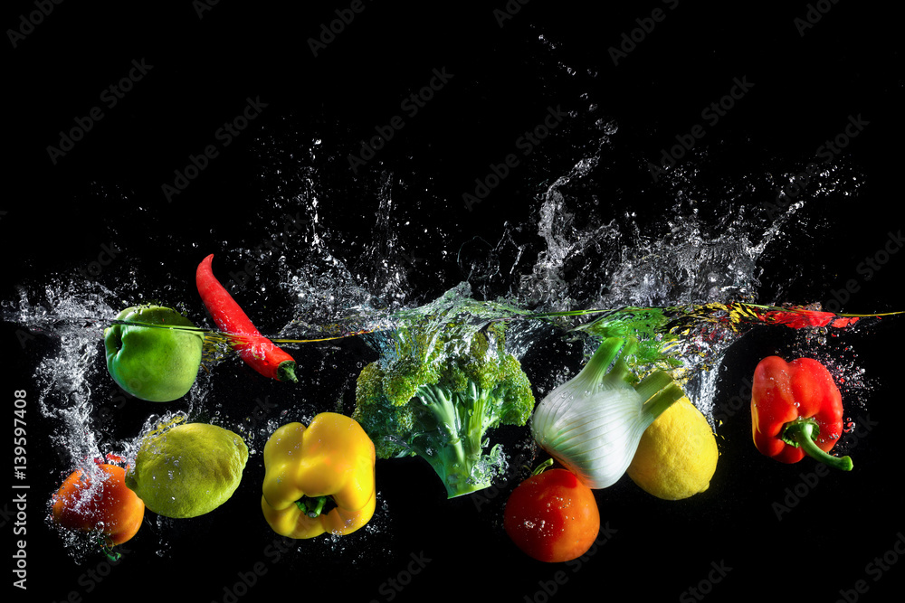 Vegetables splash in water