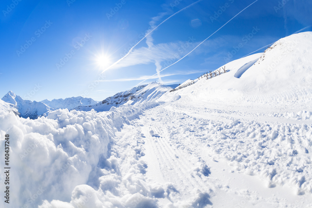 Beautiful mountain scene with snowy alpine path