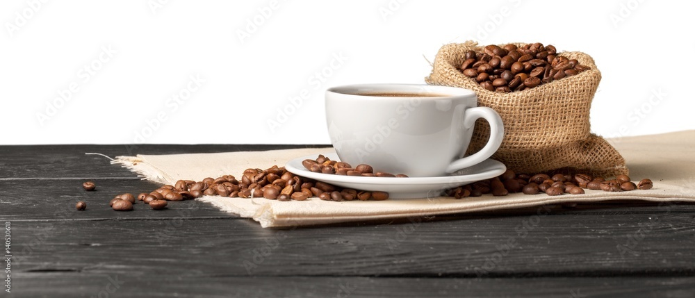 Coffee cup with coffee beans.