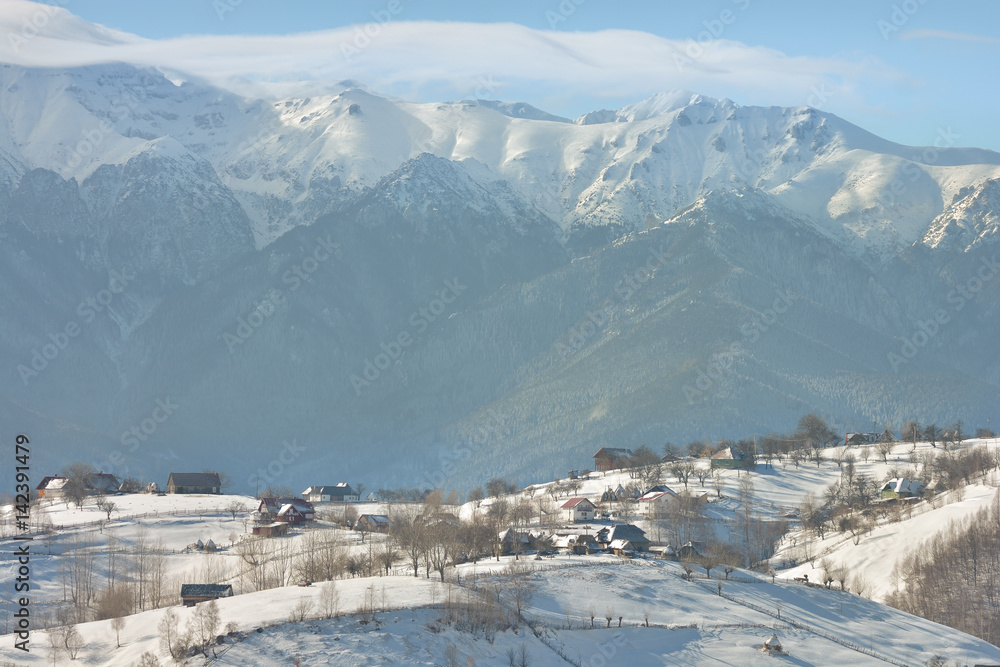 Beautiful winter mountain landscape with snowflakes in frosty winter day. Carpathian wild mountains.
