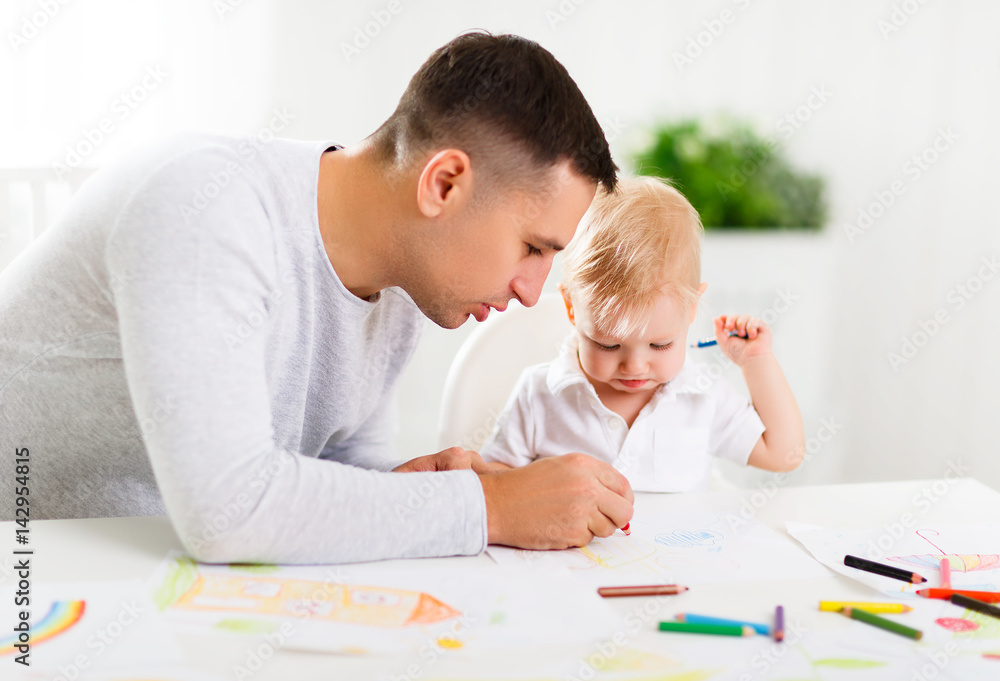 father and baby son paint together