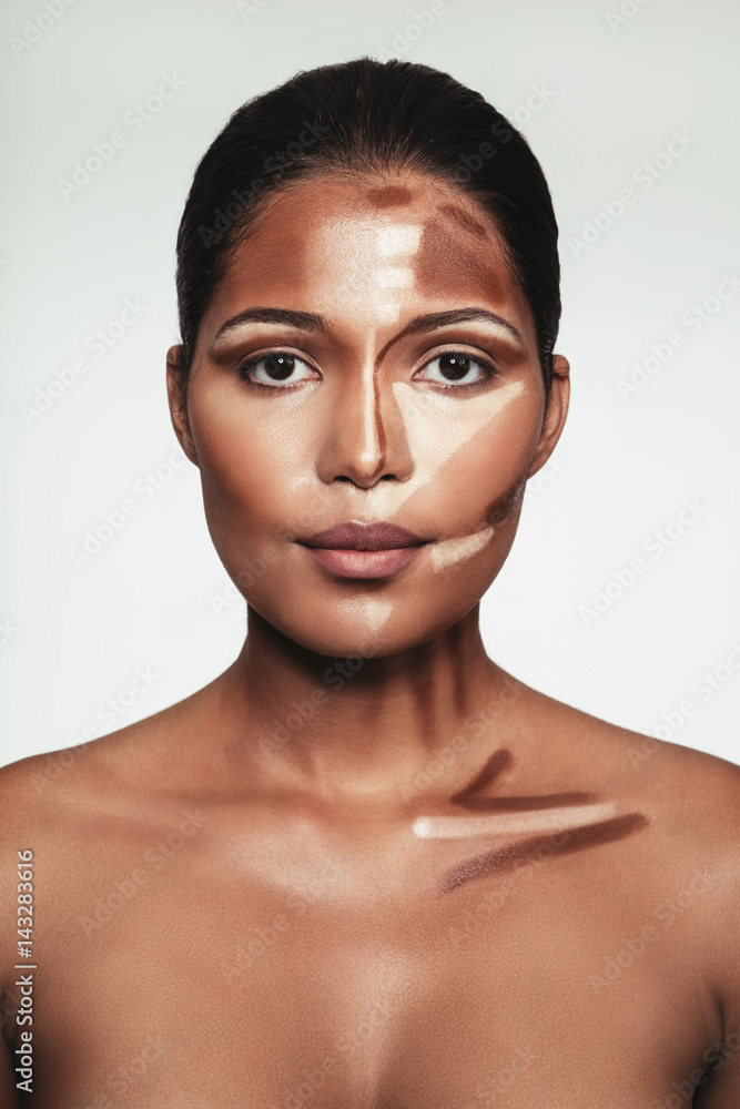 Young woman with contour and highlight makeup on face