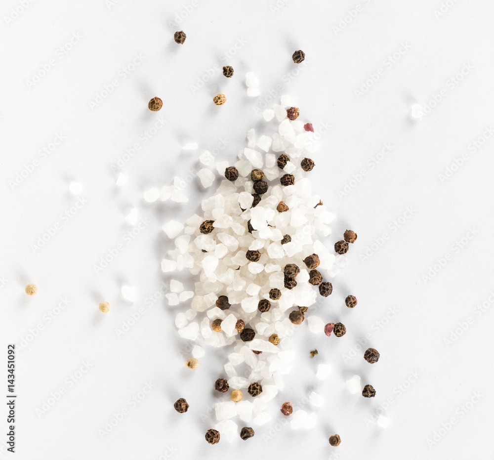 Salt and mix of pepper on white background. Top view.