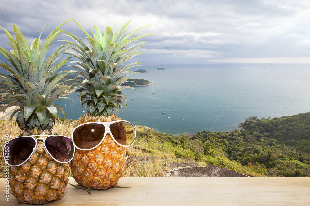 pineapple with sunglasses with Phahindum viewpoint new landmark in Phuket Thailand,near promthep cap