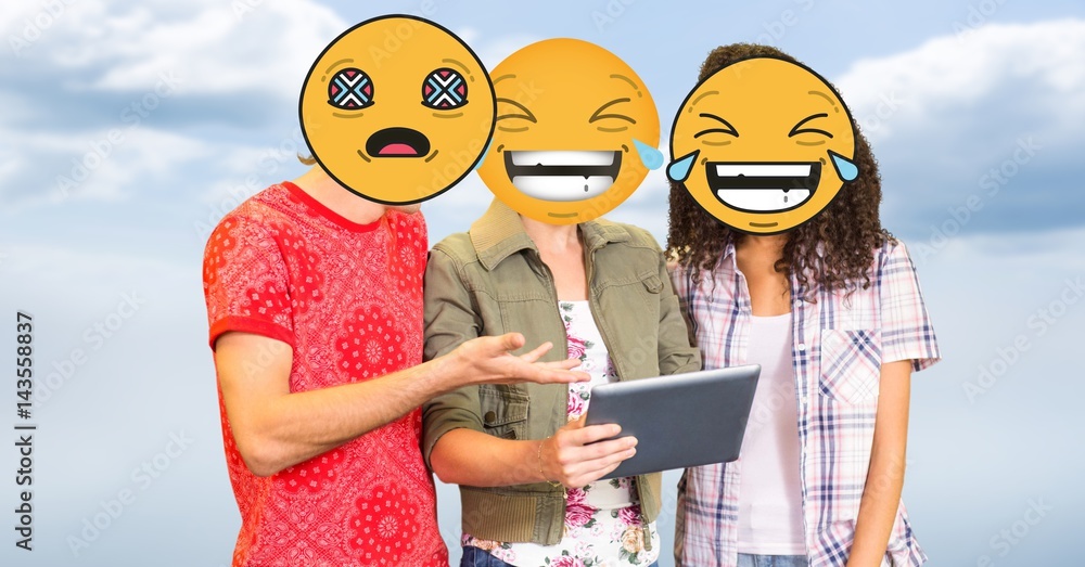 People using tablet PC with emojis over faces