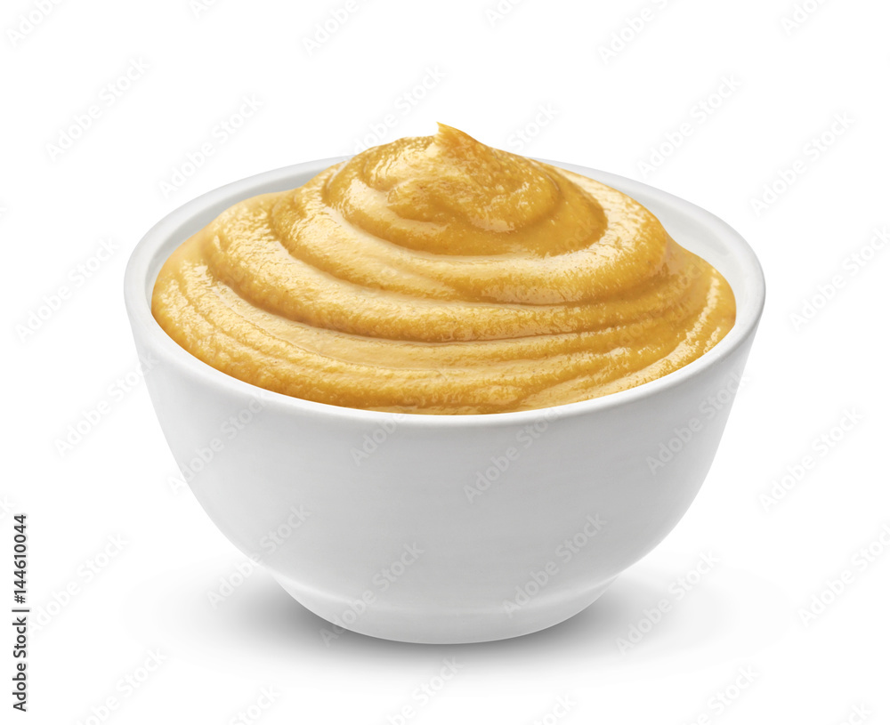 Mustard sauce in bowl isolated on white background. One of the collection of various sauces