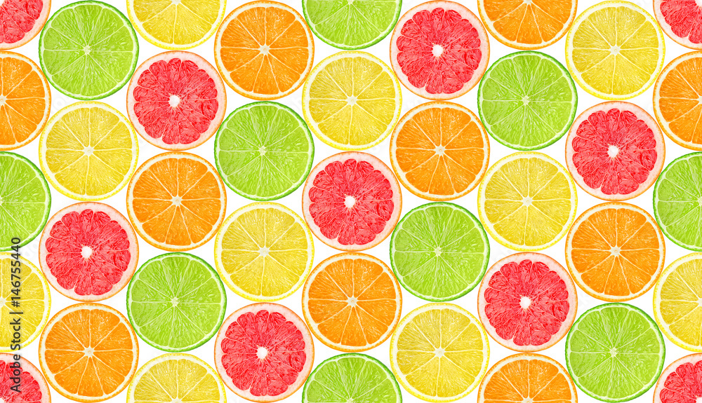 柑橘类水果图案。无缝背景，橙色、柠檬、葡萄柚和酸橙水果片