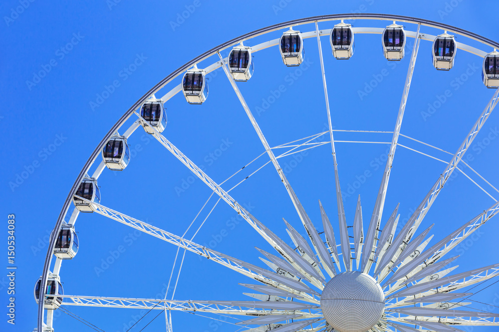 Ferris wheel over blue sky in Gdansk, Poland