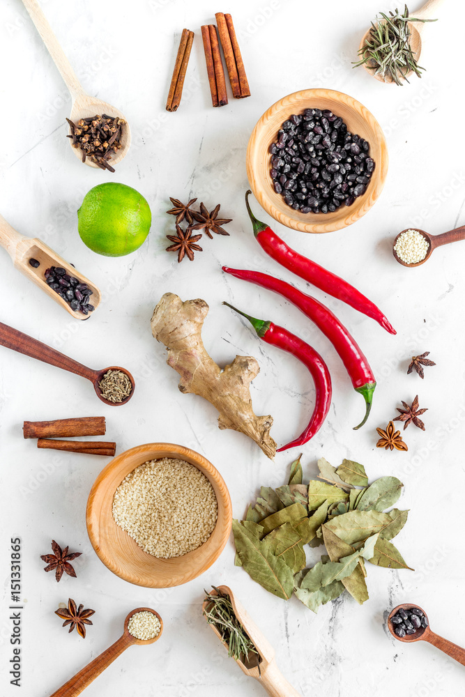 Cooking with spices, salt and pepper on kitchen table background top view