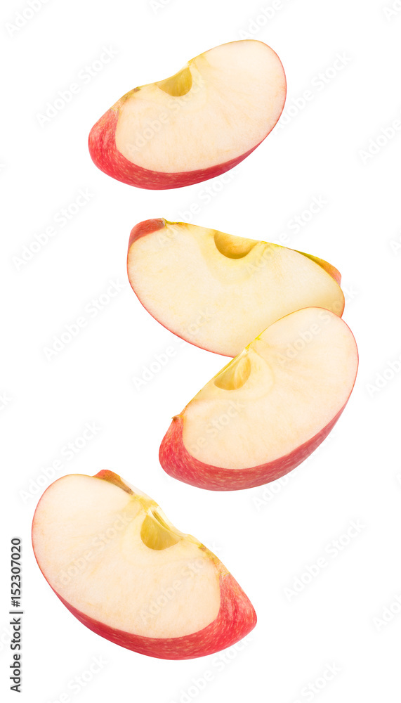 Isolated flying apple wedges. Four falling pieces of red apple fruit isolated on white background wi