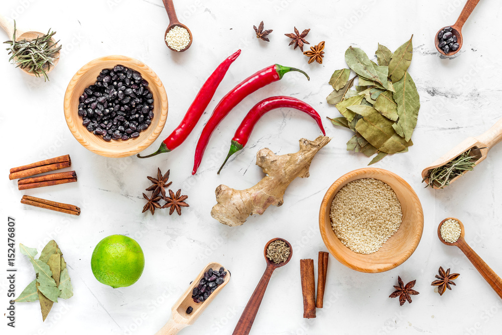 Dry colorful spices, chili pepper on kitchen stone table background top view