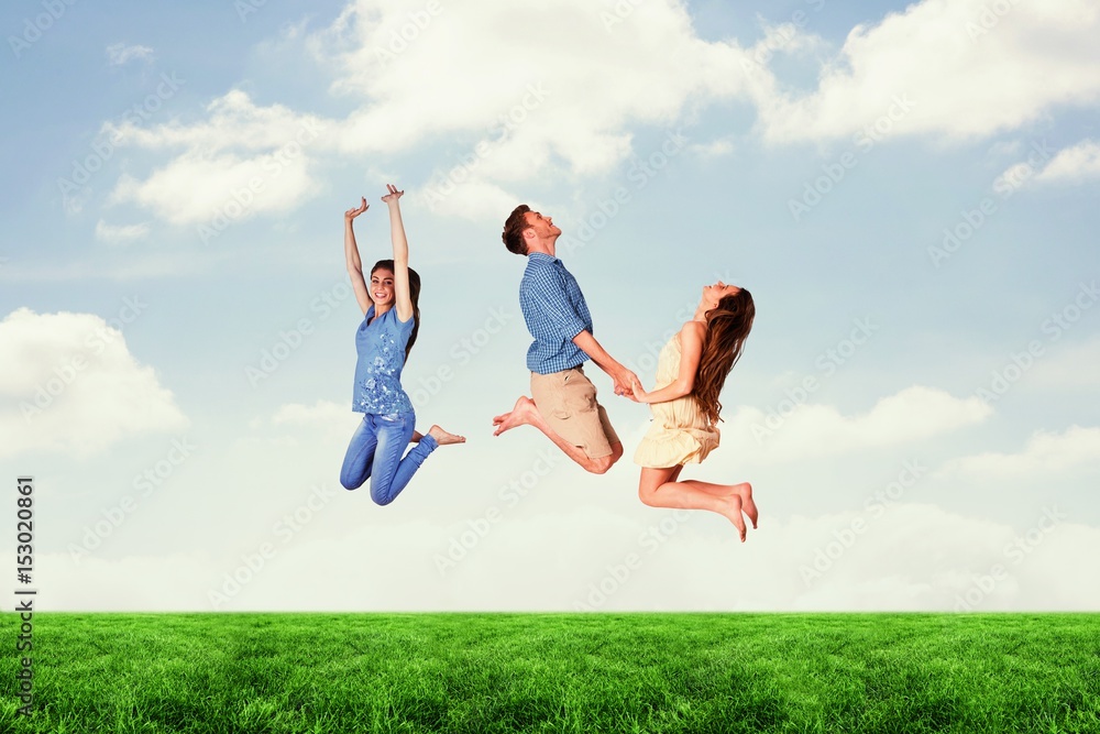 Composite image of happy friends jumping