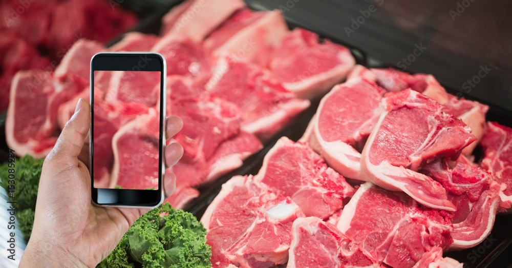 Hand photographing meat through smart phone