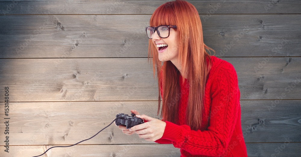 Redhead woman playing video game 