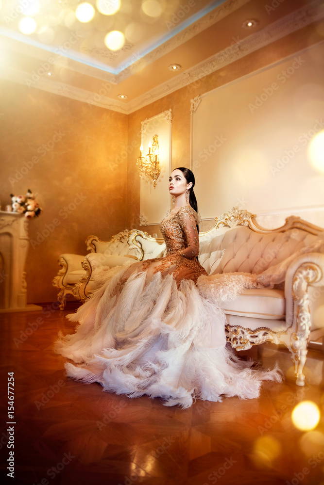 Beauty gorgeous woman in beautiful evening dress in luxurious style interior room. Elegant lady full