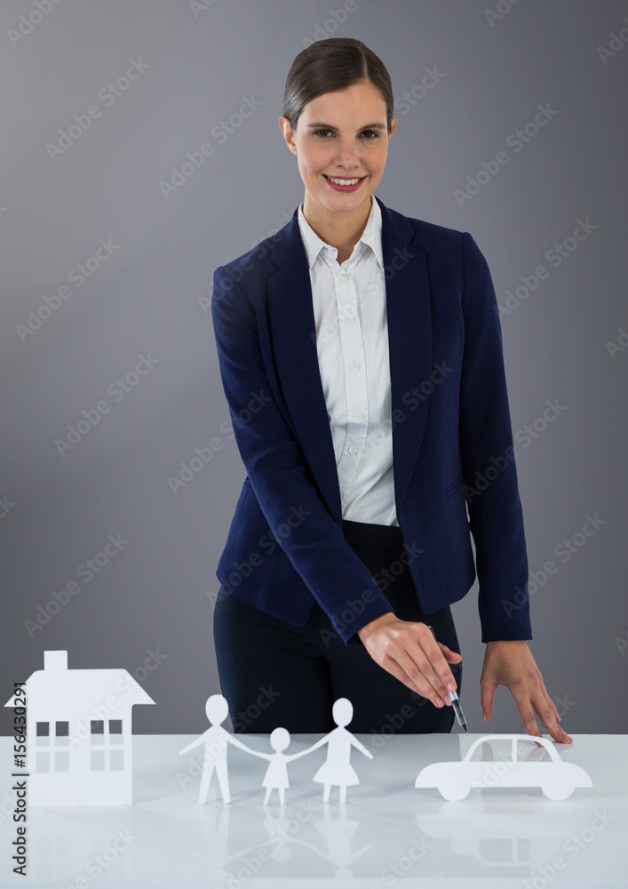 Cut outs of house family and car with woman