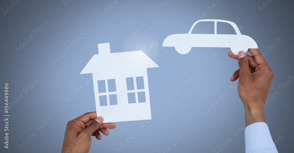Cut out house and car in hands