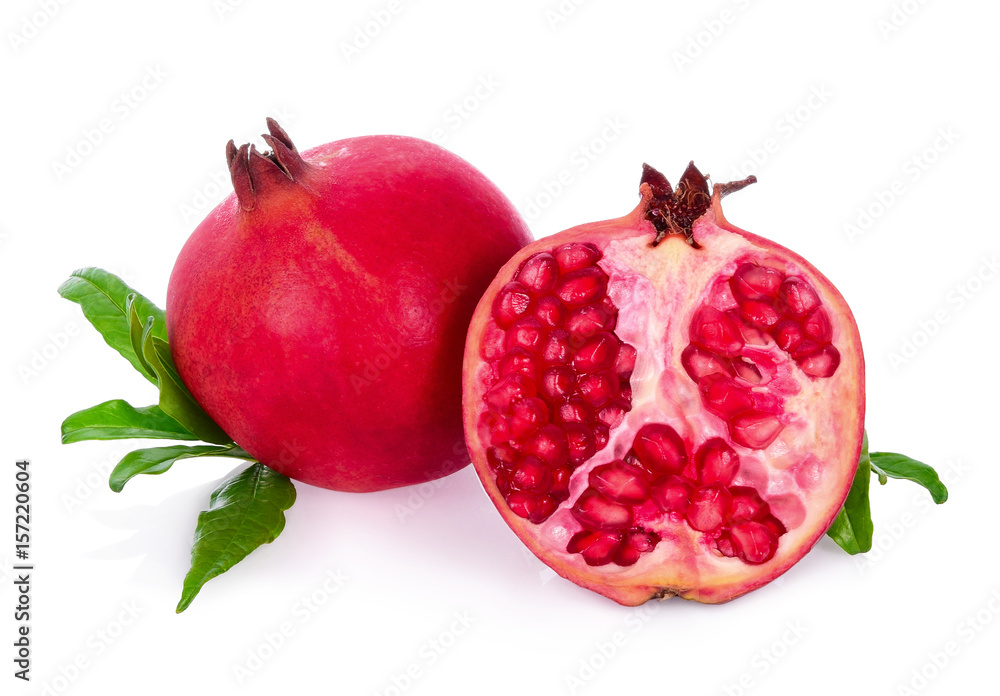 Whole pomegranate and a half with leaves Isolated on white background.