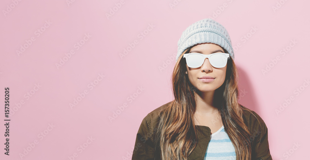 Hipster girl wearing sunglasses and hat