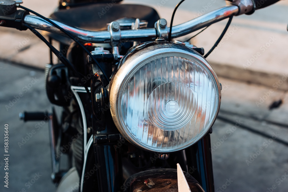 Close-up view on retro motorcycle headlights.
