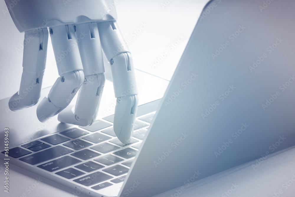 Chat bot , artificial intelligence , robo advisor , robotic concept. Robot finger point to laptop bu